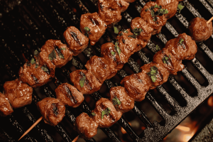 Watch as tender mutton pieces sizzle over hot coals, absorbing the smoky flavors and spices, for a deliciously grilled treat of mutton satay